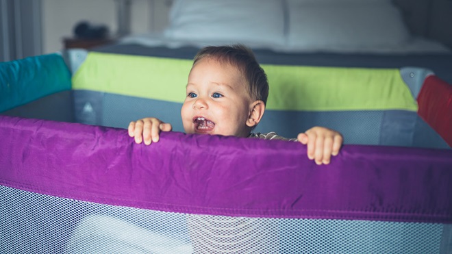 baby_in_portable_cot_in_bedroom_lead